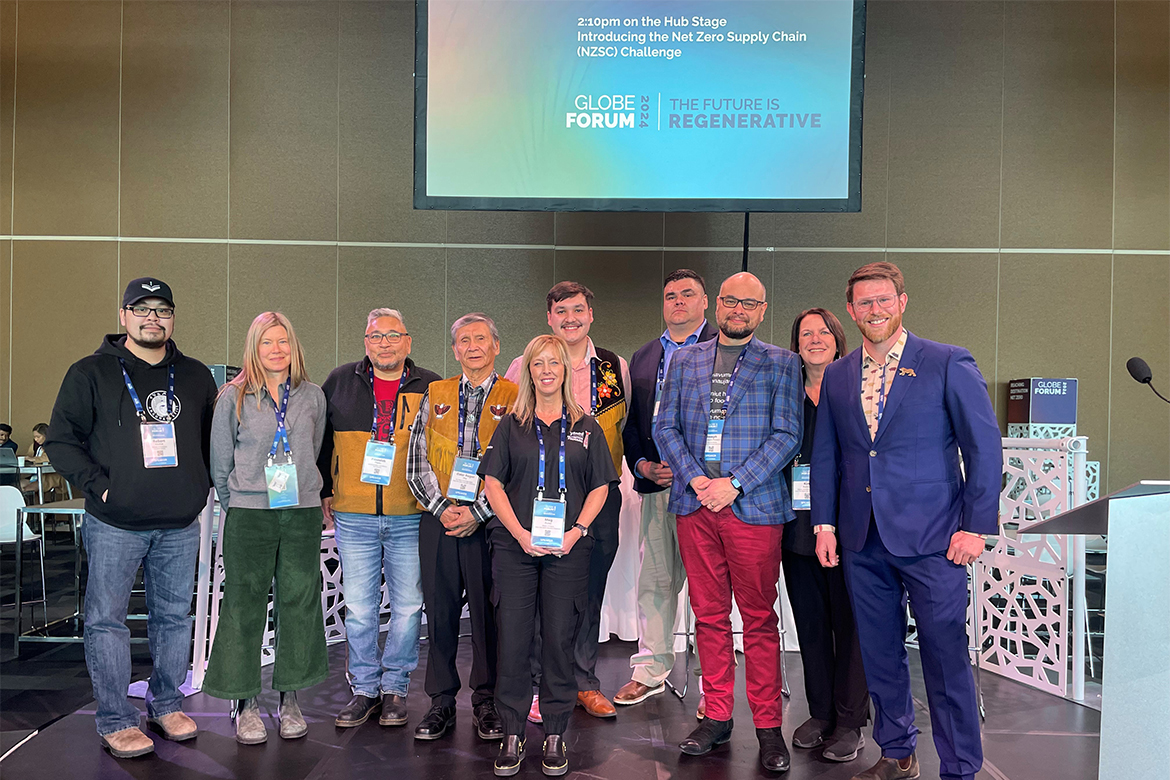 CanNor staff and NFIC participants pose for a group shot at the end of the presentation at the Globe Forum.