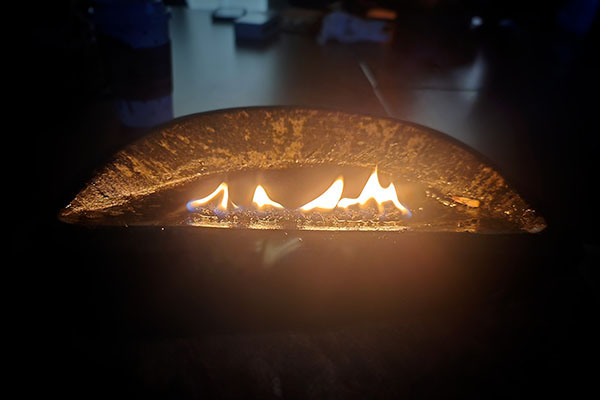 Qulliq flame in a dark room.